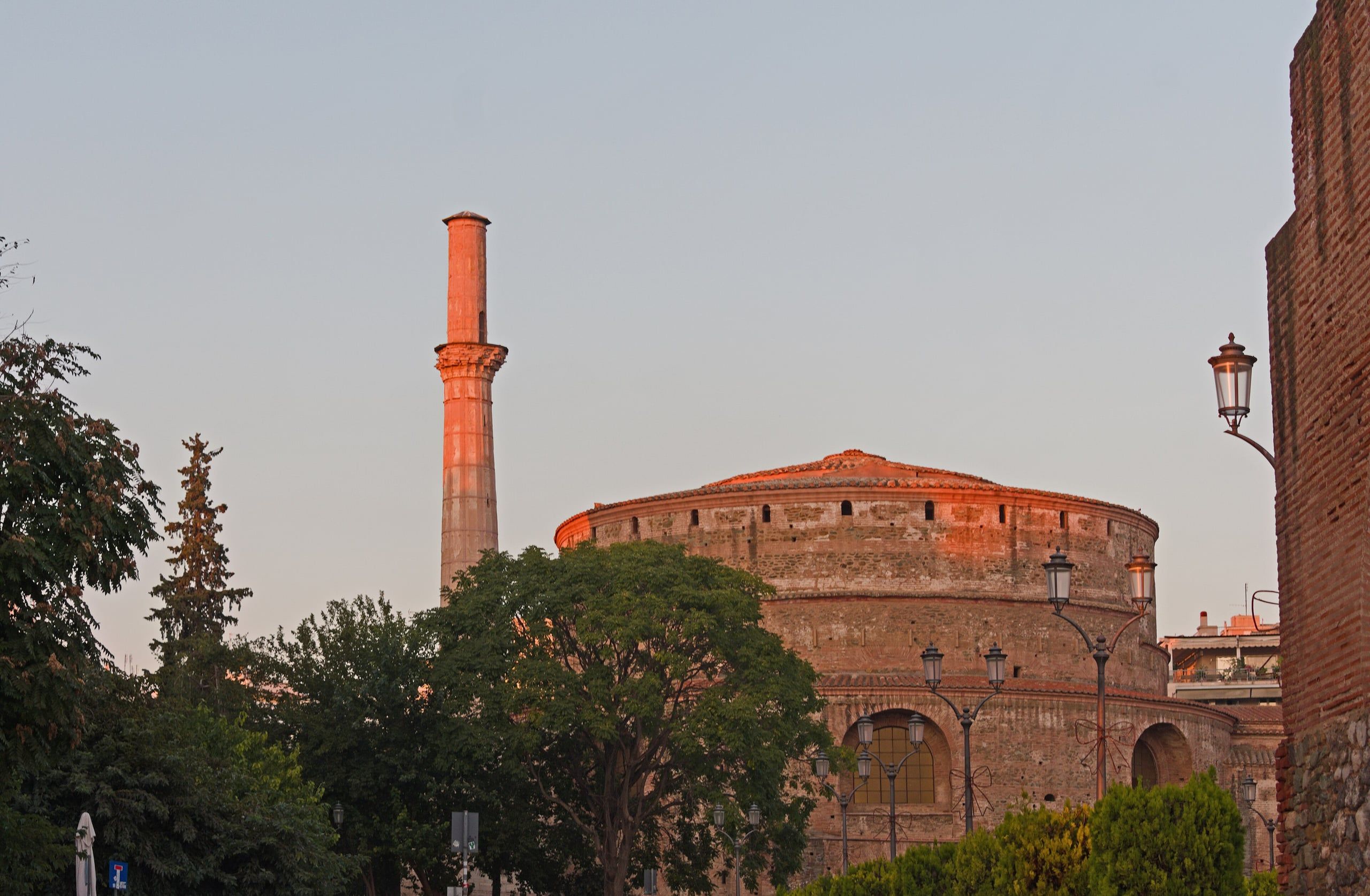 The brick Rotunda of Thessaloniki and its minaret in soft evening light
